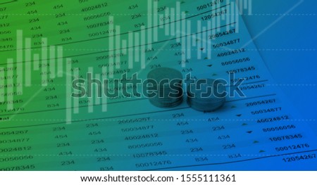 Financial concept Graphics. Graph, coins and Datasheet  Royalty-Free Stock Photo #1555111361