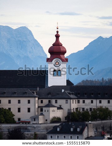Admiring the vibrant architecture and surrounding mountains of Salzburg, Austria. 
