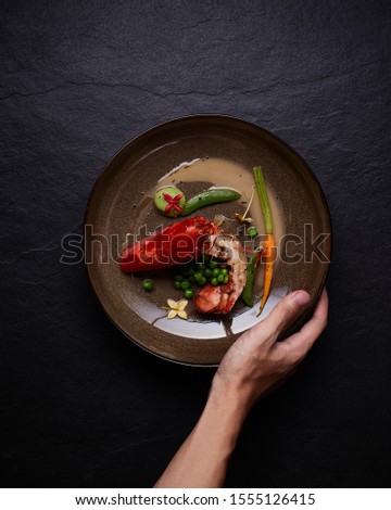 Beautiful and tasty food on a plate, exquisite dish, creative restaurant meal concept
 Royalty-Free Stock Photo #1555126415