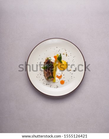 Beautiful and tasty food on a plate, exquisite dish, creative restaurant meal concept
 Royalty-Free Stock Photo #1555126421