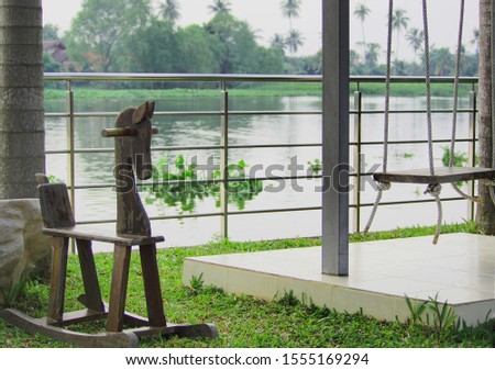 swing wood and rocking chair  in garden slow life Concept