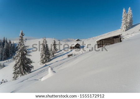 Beautiful pictures of nature in winter. Landscape with mountain huts in the snow. 
