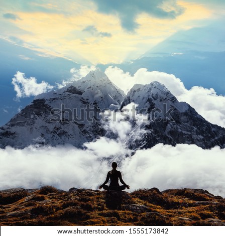 Serenity and yoga practicing at himalayas mountain range, meditation  Royalty-Free Stock Photo #1555173842