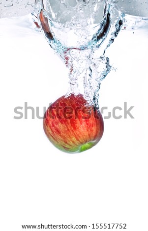 fresh apple dropped into water, isolated on white background 6.