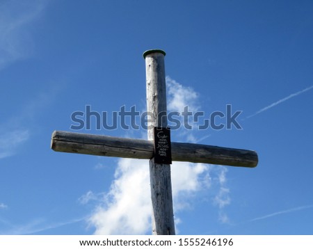 A wooden cross in the Alps, with the reconforting words 'There is nothing that Jesus cannot handle' (Adelboden, Switzerland)                               