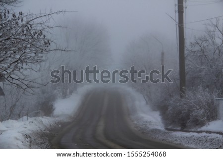 A Winter road to the fog