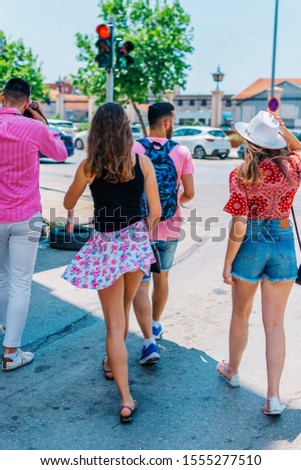 Four tourist's (explorers) taking a walk at a Mediterranean city.