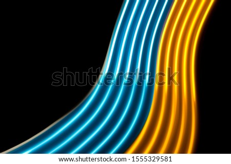 Yellow and blue light curve lines on a black background 	