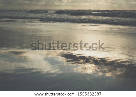 close up of sea waves on a sandy beach