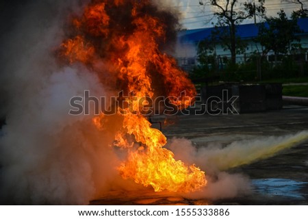 Fire explodes dangerously from the burning gasoline. 