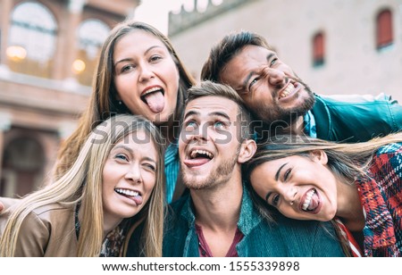 Best friends taking selfie at city tour trip - Happy friendship with millennial people having fun together outdoor - Everyday life concept of new generation representatives enjoying carefree lifestyle