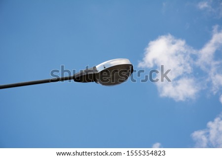 Picture of electric lamp on electricity poles in the daytime