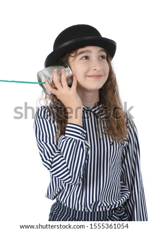 Young girl call by tin can phone isolated on white. High resolution photo. Full depth of field.