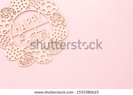 happy Easter sign on a pink background.