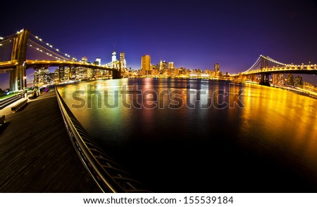 Manhattan Bridge and Brooklyn Bridge with Manhattan skyline At Night taken with fisheye lens