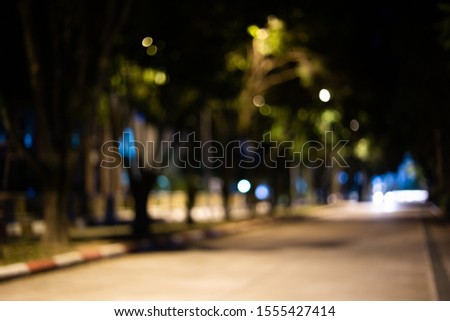 City park blur, abstract at night and with bokeh light,
Green bokeh blur at night in winter background