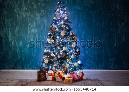 Christmas tree lights garlands new year decoration gifts as background