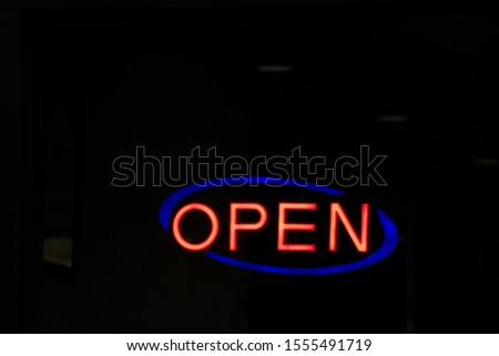 Neon open sign, night time