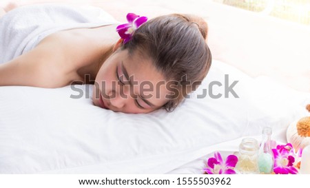 An asian beautiful woman is sleeping well on comfortable bed while doing aromatherapy