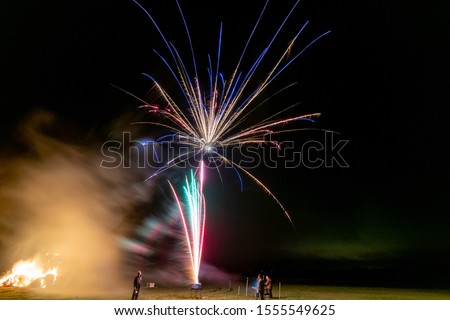 Long exposure of fireworks in the sky.