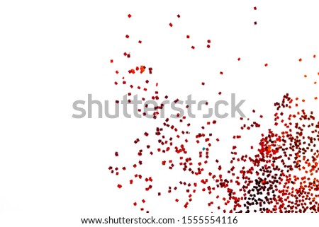 Red glitter powder splash or burst isolated on white background
