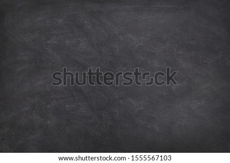 Blackboard  Chalkboard texture.Empty blank black chalkboard.School board background with traces of chalk. Cafe, bakery, restaurant menu template. Royalty-Free Stock Photo #1555567103