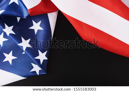 Close up of national usa american flag on black background with copy space