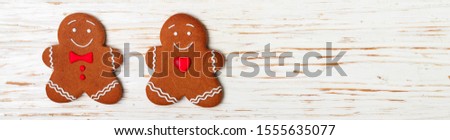 Gingerbread. Traditional new Year and Christmas treats. Cookies in the form of merry men. The concept of the celebration. Holidays. Top view, selective focus, copy space, long picture, banner