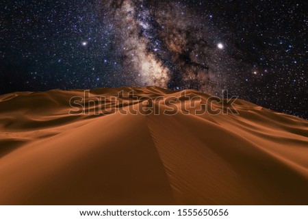Amazing views of the Sahara desert under the night starry sky Royalty-Free Stock Photo #1555650656