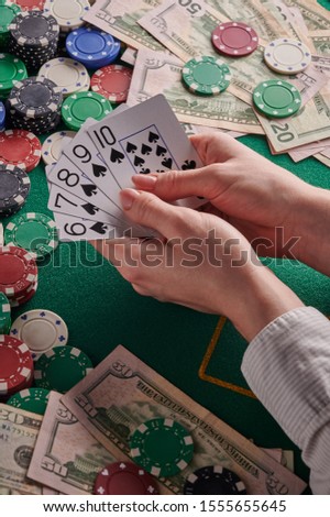 to a poker player in a casino, a combination in straight cards, a lot of money and chips