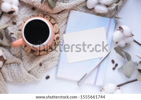 card mockup with cotton flowers and eucaliptus. coffee beans. cup