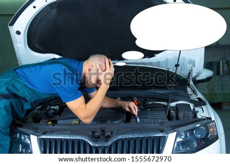 Funny picture with bubble idea car mechanic repair the car engine.
