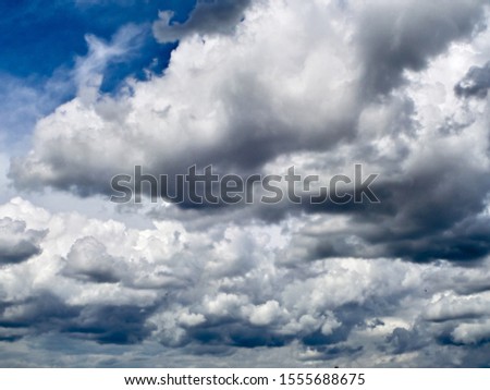 Beautiful thunderclouds. Fluffy volumetric clouds before a thunderstorm. The background symbolizes the power of nature. Image stock for design. Sky texture.