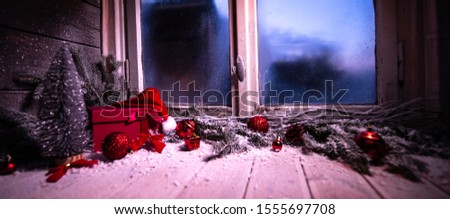 Festive wooden Christmas cabin window with gift-wrapped - Winter window with snow and ice Christmas decoration gifts