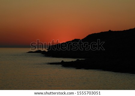 a scenic sunset in the Aegean