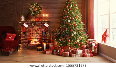 interior christmas. magic glowing tree, fireplace and gifts   Royalty-Free Stock Photo #1555721879