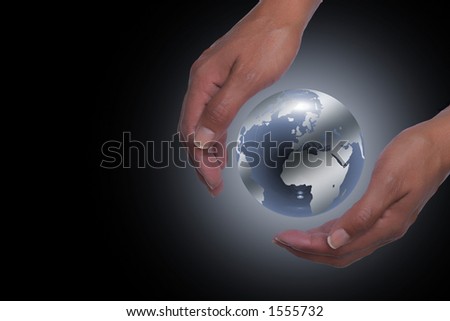 Hands holding planet earth in black background