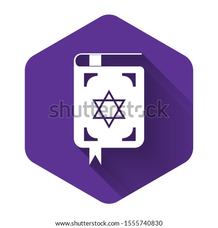 White Jewish torah book icon isolated with long shadow. The Book of the Pentateuch of Moses. On the cover of the Bible is the image of the Star of David. Purple hexagon button