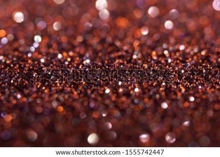 A porous structure similar to a scattering of precious stones or cooling lava from a volcano. Shallow depth of field. Magic bokeh. Bright background and backdrop.