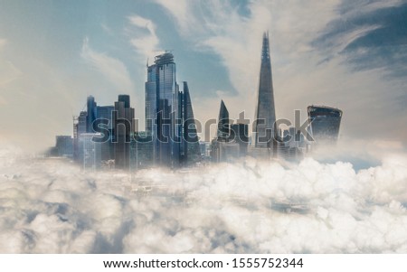 City of London view, Skyscrapers raising above clouds. London, UK