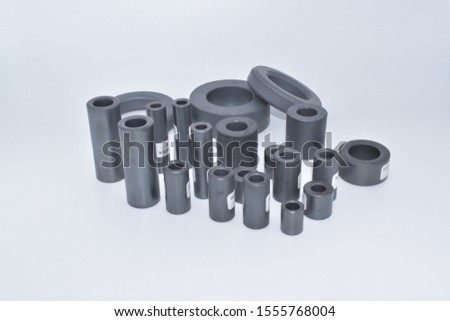 Toroidal and Axial Ferrite for EMI suppression. perfect for test and measuring purposes in EMC test labs. Ferrite chokes for emission test. In general for wires, coaxial cables, wire-wrapping cables. Royalty-Free Stock Photo #1555768004