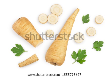 Parsnip root and slices with parsley peppercorns isolated on white background closeup. Top view. Flat lay Royalty-Free Stock Photo #1555798697