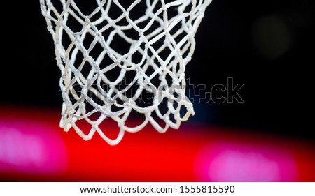 Empty Swooshing Basketball Net Close Up with Dark Background 