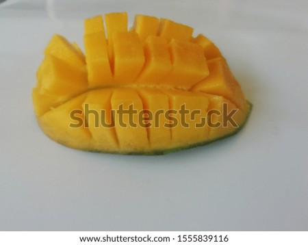 Piece of mango already in the Peel isolated white color