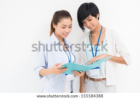 Isolated image of modern businesswoman in casual analyzing the strategy on white
