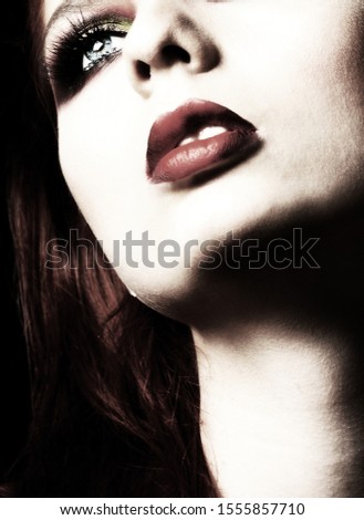 Blur. Beautiful eyes, lips and a long neck of a nice woman. Makeup. Long lashes.  Vogue. Fashion. Beauty. 