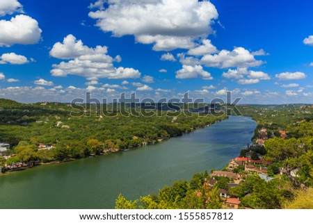 The view from the top of Mount Bonnellin in Austin, Texas. You can climb to the top, have a picnic, hike the trail, see great views of Lake Austin on the Colorado River and the city. Royalty-Free Stock Photo #1555857812