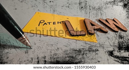 patent law Action copy write concept of rough paper pen abstract background 