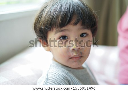 Asian Child Boy face Looking His face is colored.