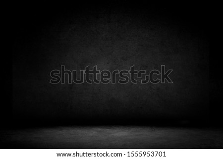 Dark room with concrete floor and dark wall background.Product showcase spotlight background.
